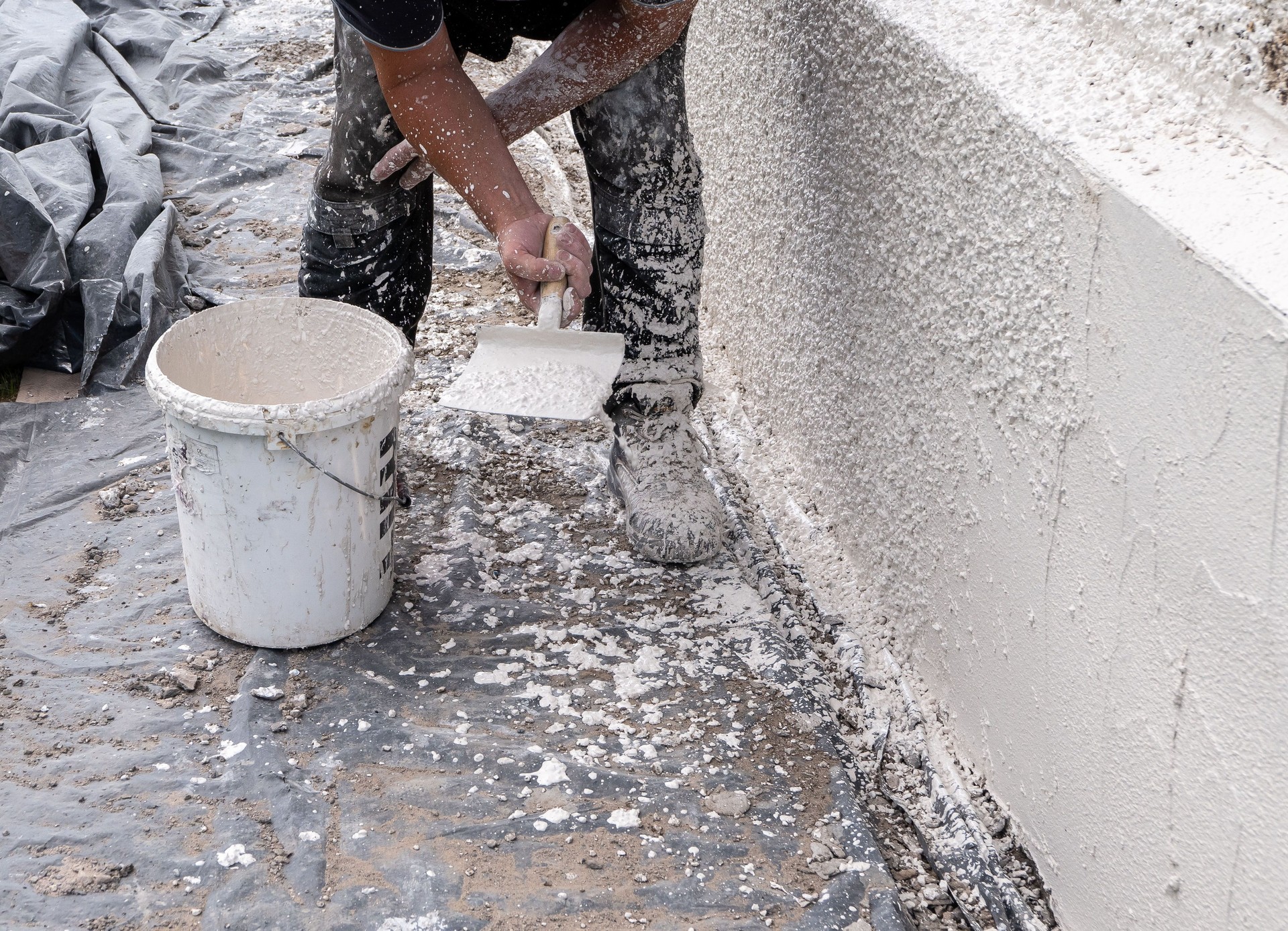 Rough-cast harling mix being put on an external wall